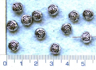 Kovové korálky,stř.kytička,5x7mm,1ks