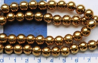 Opracovaný kámen,hematit, zlatá kulička, 6mm,1ks